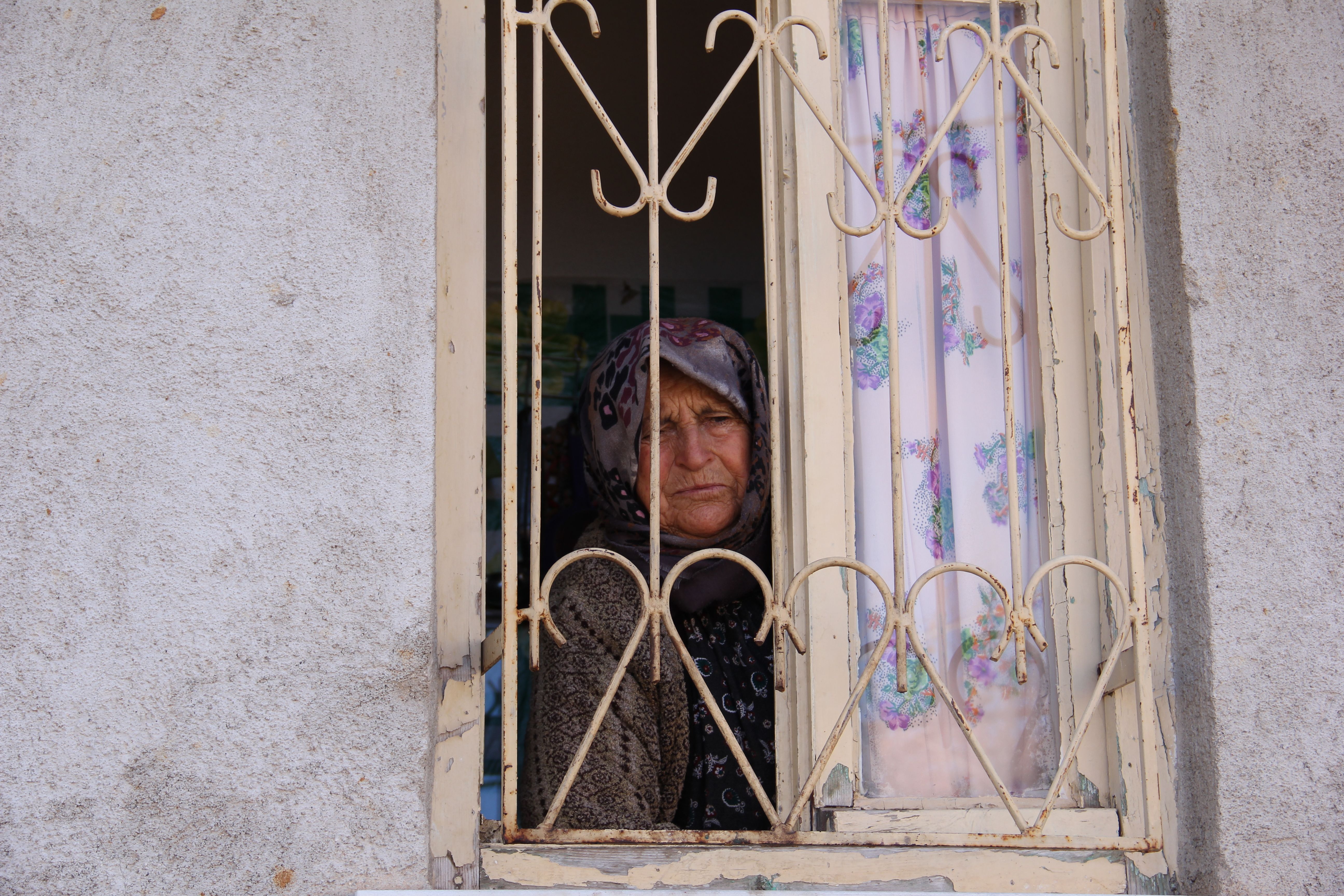 elderly woman window