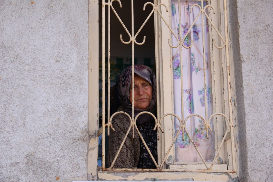 elderly woman window
