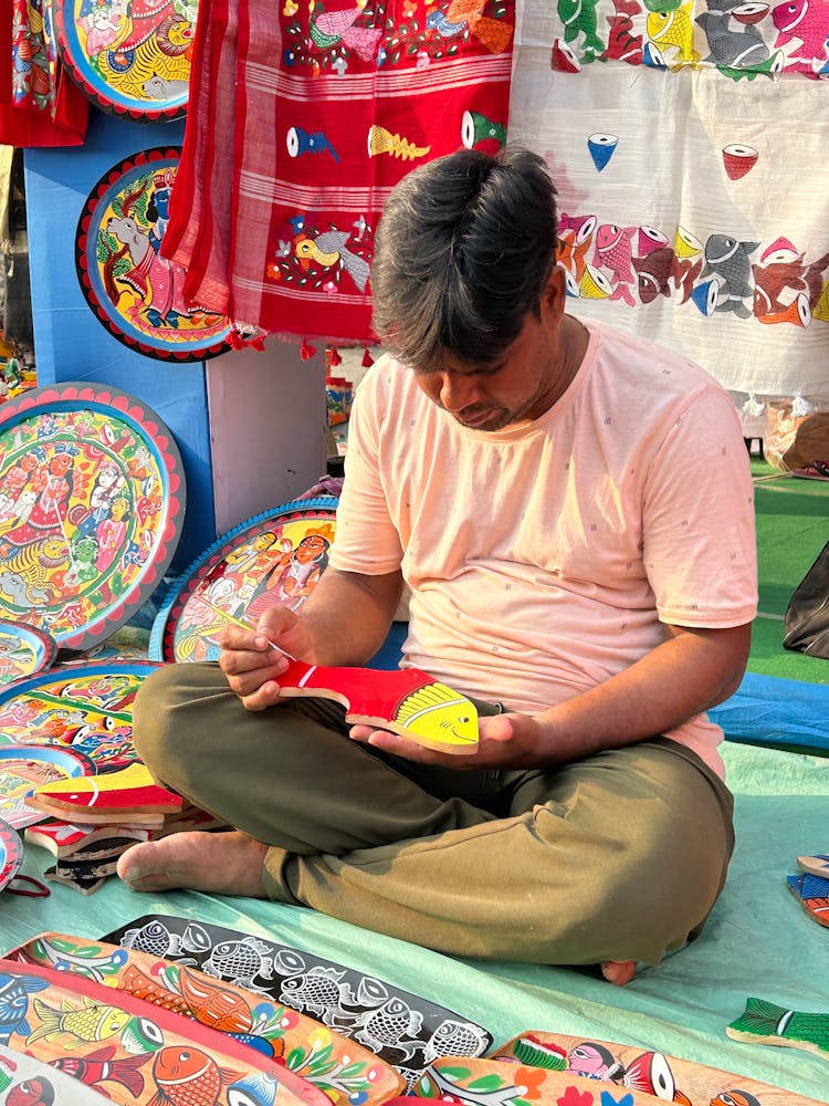 Artisan Painting Wooden Fish