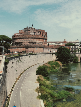 Explore Rome's iconic Castel Sant'Angelo near the serene Tiber River.