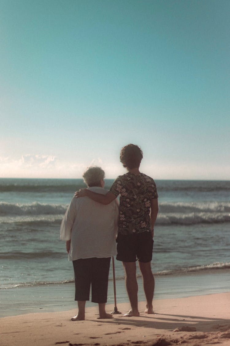 Grandma With Grandchild On Sea Shore