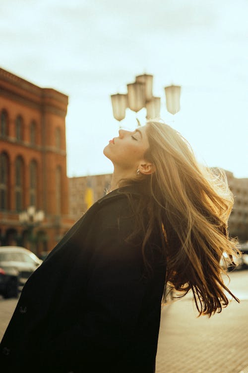 Model in Coat Tossing her Hair