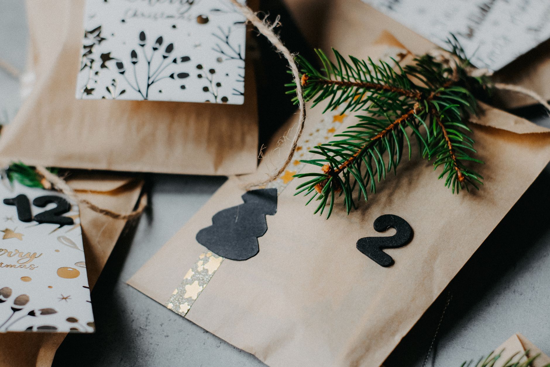 Close-up of festive advent calendar packages with Christmas decor and numbers.