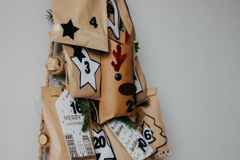 Advent or Countdown Calendar DIY home decor project — Handcrafted advent calendar with decorated paper bags and festive numbers for Christmas countdown.