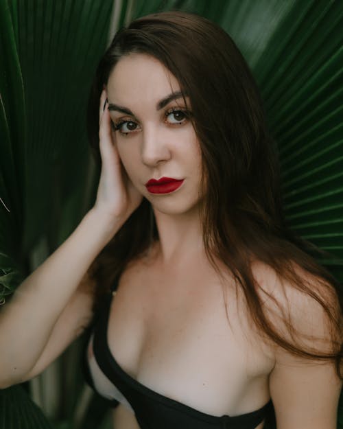 Portrait of a Shirtless Brunette Wearing Red Lipstick