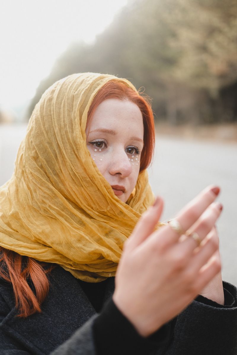 Woman in a winter coat with a yellow headscarf