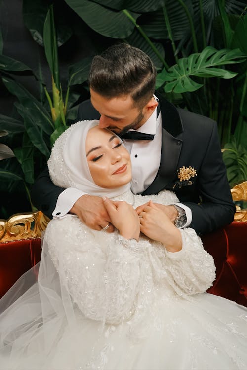 Elegant Couple on Wedding Day Showing Affection