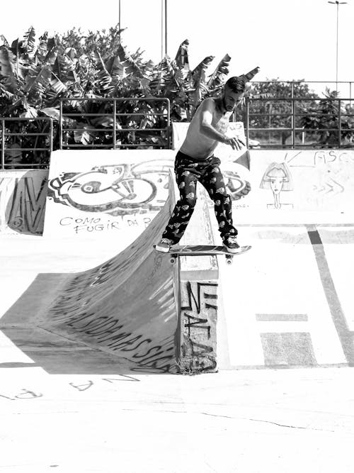 Man Making Tricks in Skate park