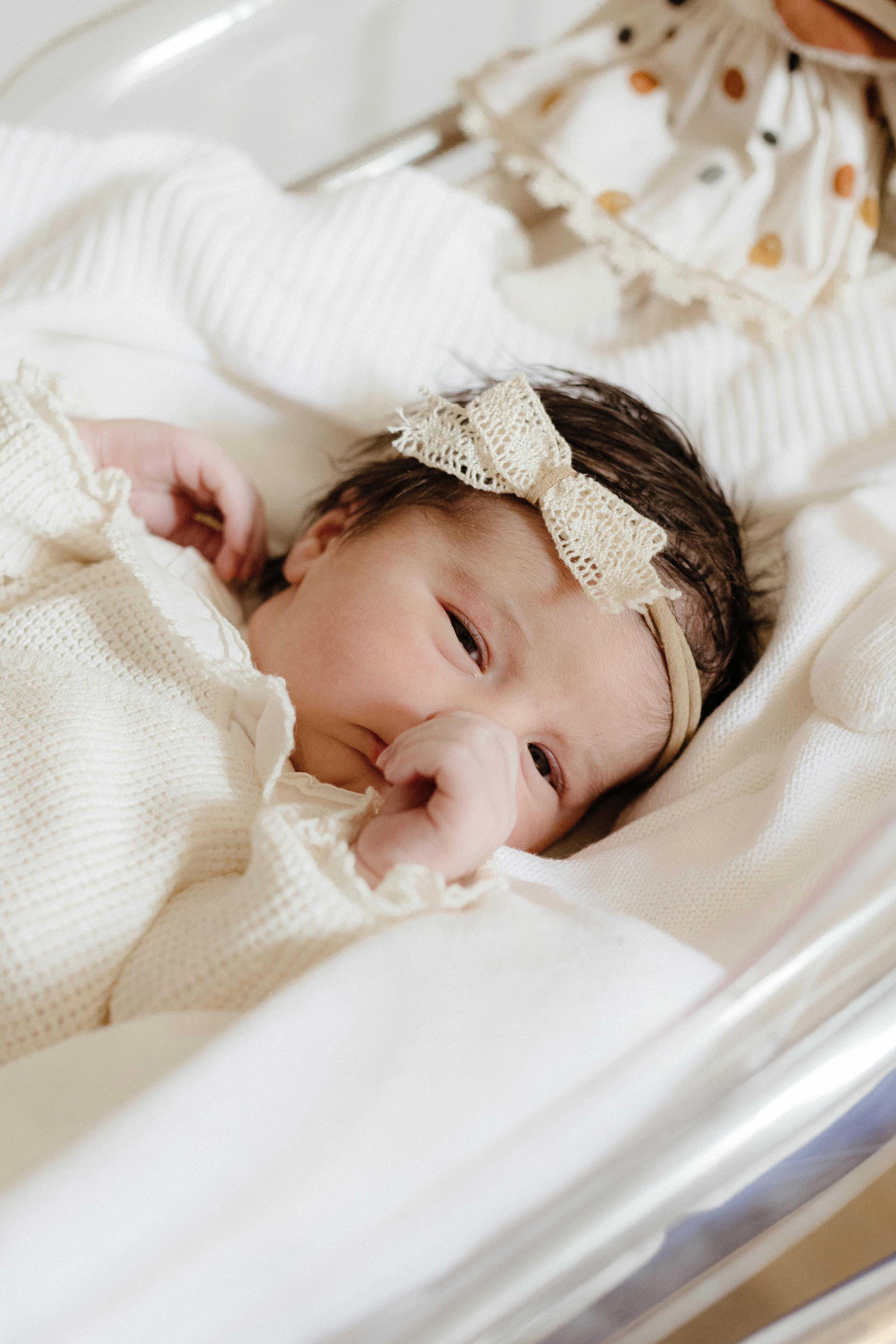 Baby Girl in Bed Free Stock Photo