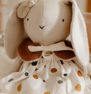 Handmade bunny toy with embroidered features — photo by Jonathan Borba on Pexels