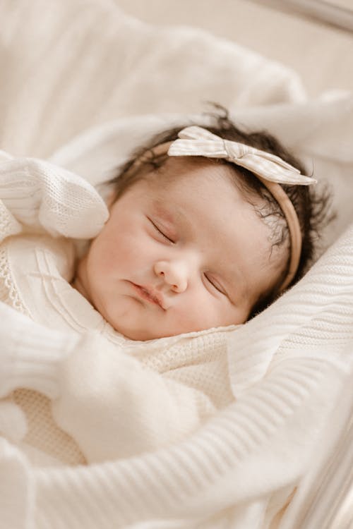 Baby with Hairband Lying Down and Sleeping