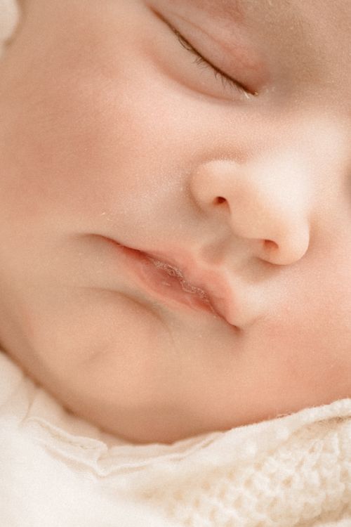 Free Close-up portrait of a peacefully sleeping baby's face with eyes closed. Stock Photo