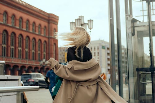Back View of Blonde Woman in Coat