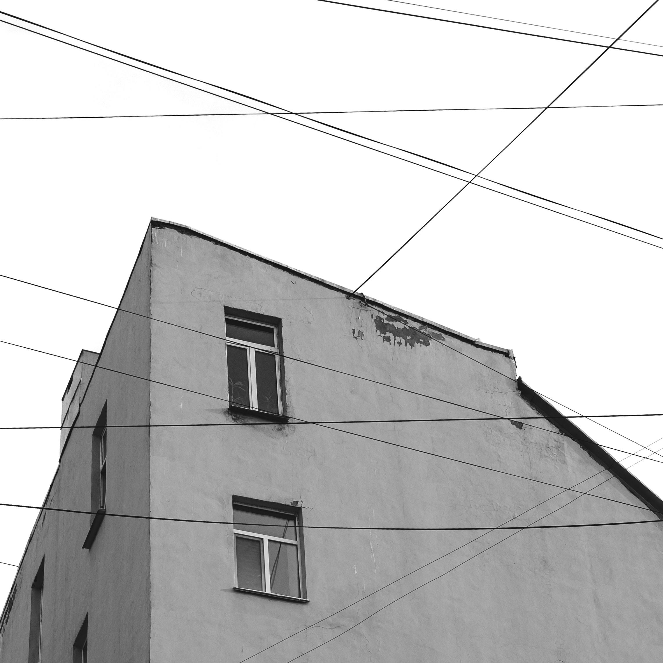 Photograph Of Buildings Near Cables Free Stock Photo photograph-of-buildings-near-cables-free-stock-photo