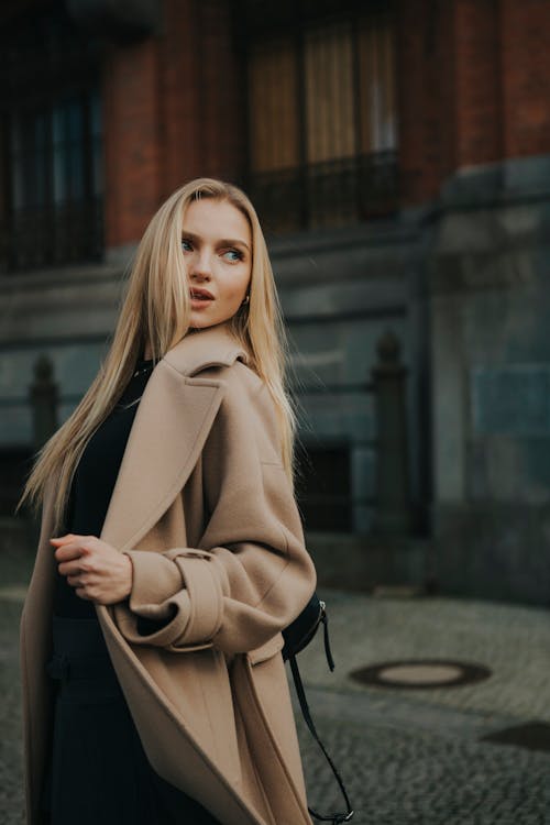 Blonde Woman Standing in Coat