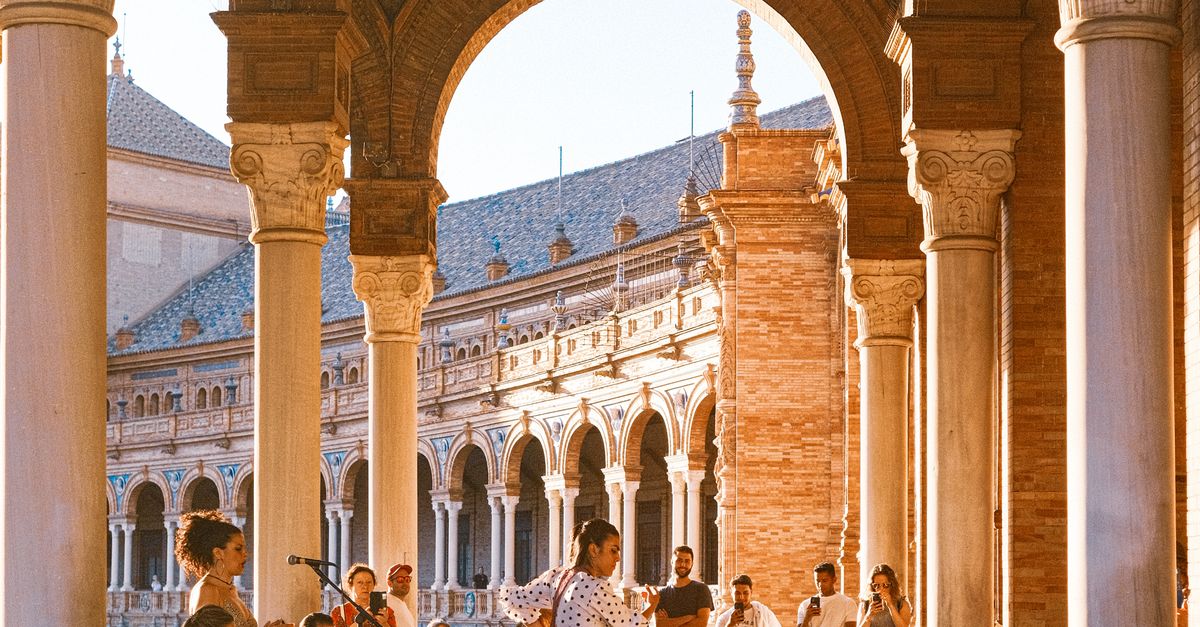 Seville 2026: Experience the Heart of Flamenco & History 10 The historic Plaza de España in Seville, Spain, with its distinctive architecture and canal.