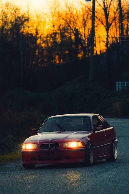 Red BMW E36 Driving Along a Country Road