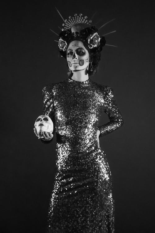 Calavera Catrina in a Sparkly Sequin Dress Holding a Skull
