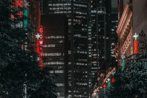 Sydney street at night with lights reflecting on wet pavement