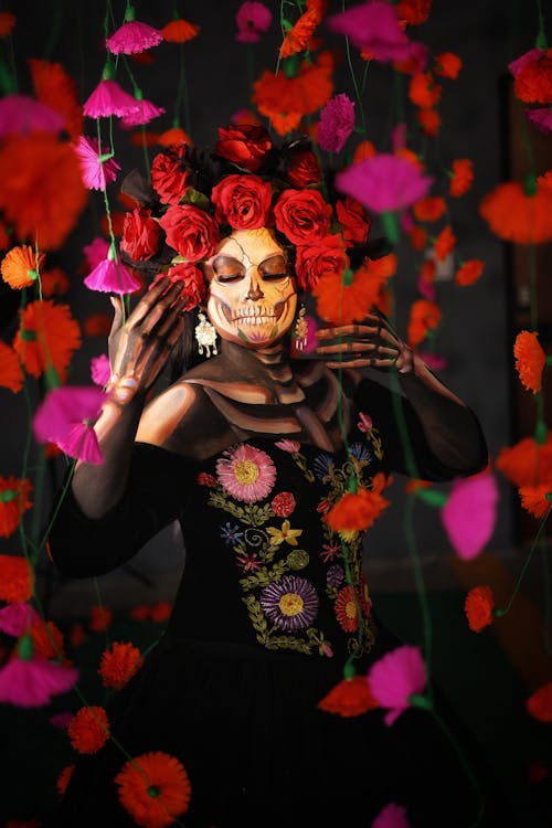 Woman with Red Roses and Skull Makeup for Dia de Muertos