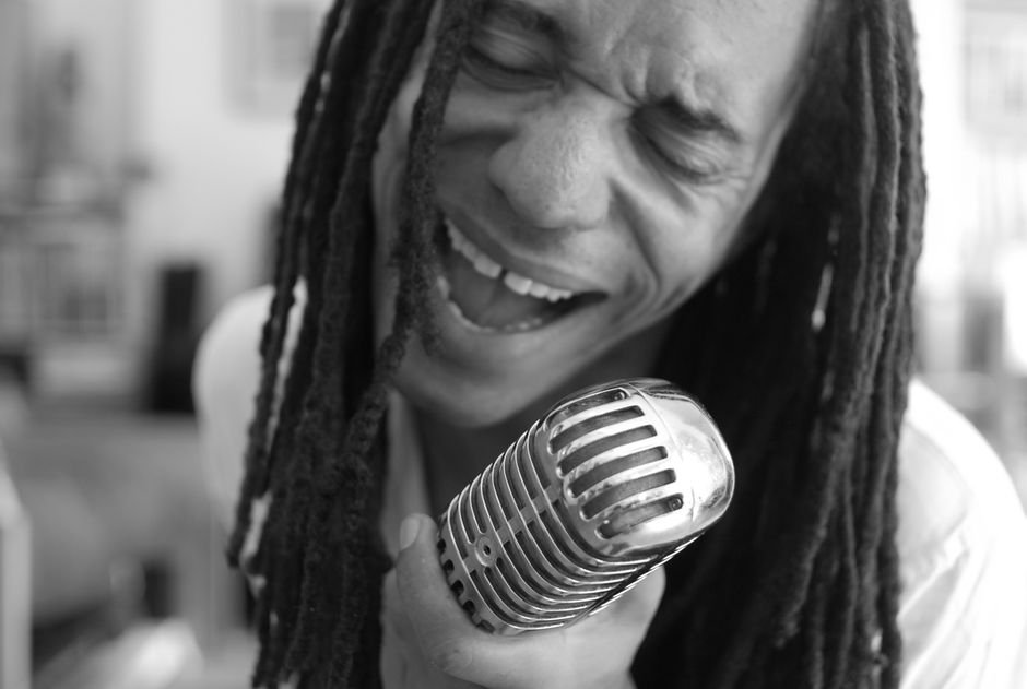 Emotional black and white close-up of a performer singing with passion in New York City.
