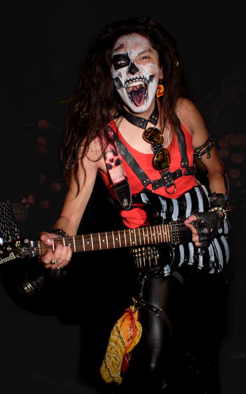 Rock Guitarist with Painted Face