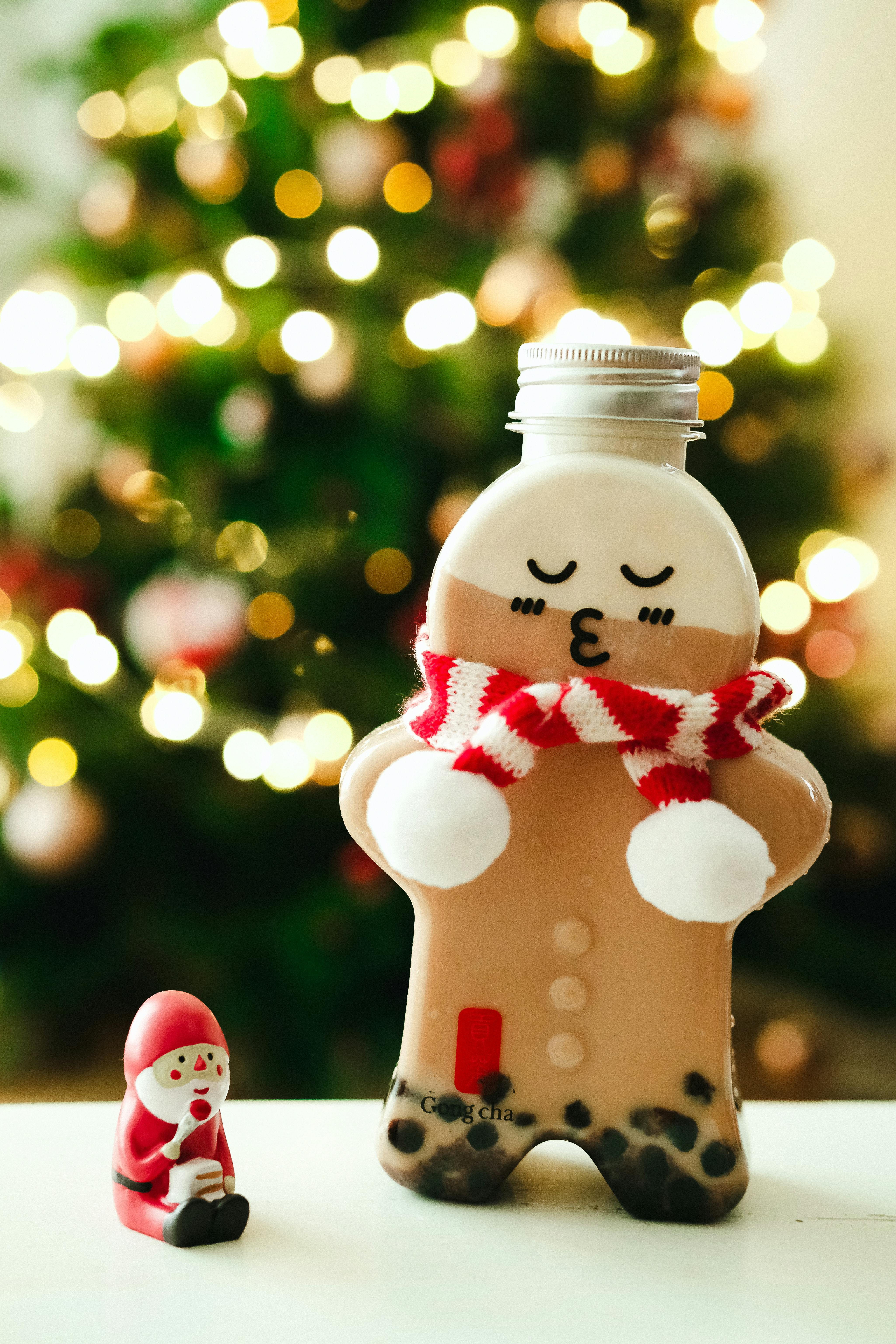 gingerbread man bottle with bubble tea and a santa claus figurine