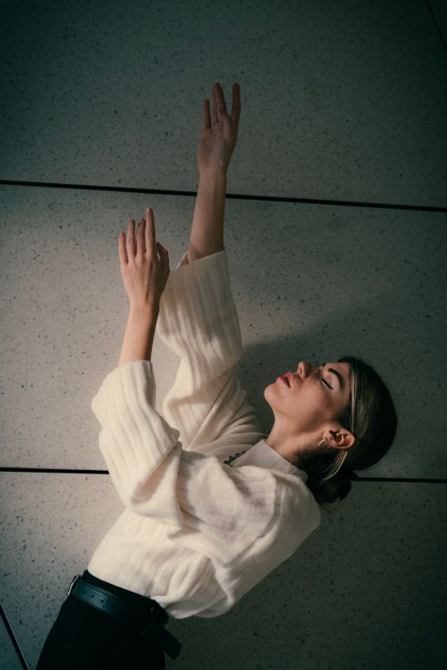 Free Elegant fashion portrait of a woman posing artistically indoors in Berlin. Stock Photo
