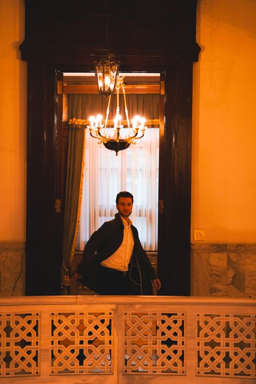 Free A man in a sophisticated Ankara setting, with elegant decor and warm lighting. Stock Photo