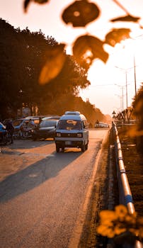 A vintage van on a sunlit road in Islamabad, capturing the essence of a sunset drive.