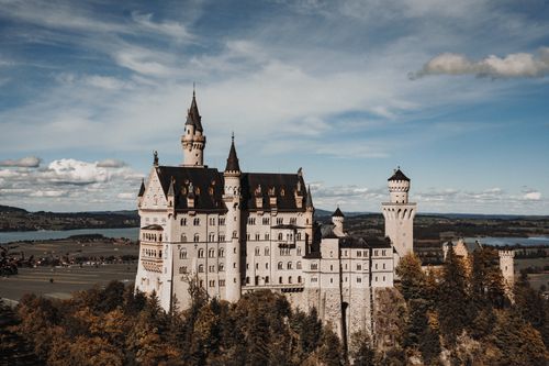 Free Stunning aerial view of Neuschwanstein Castle, a landmark in Bavaria, Germany. Stock Photo