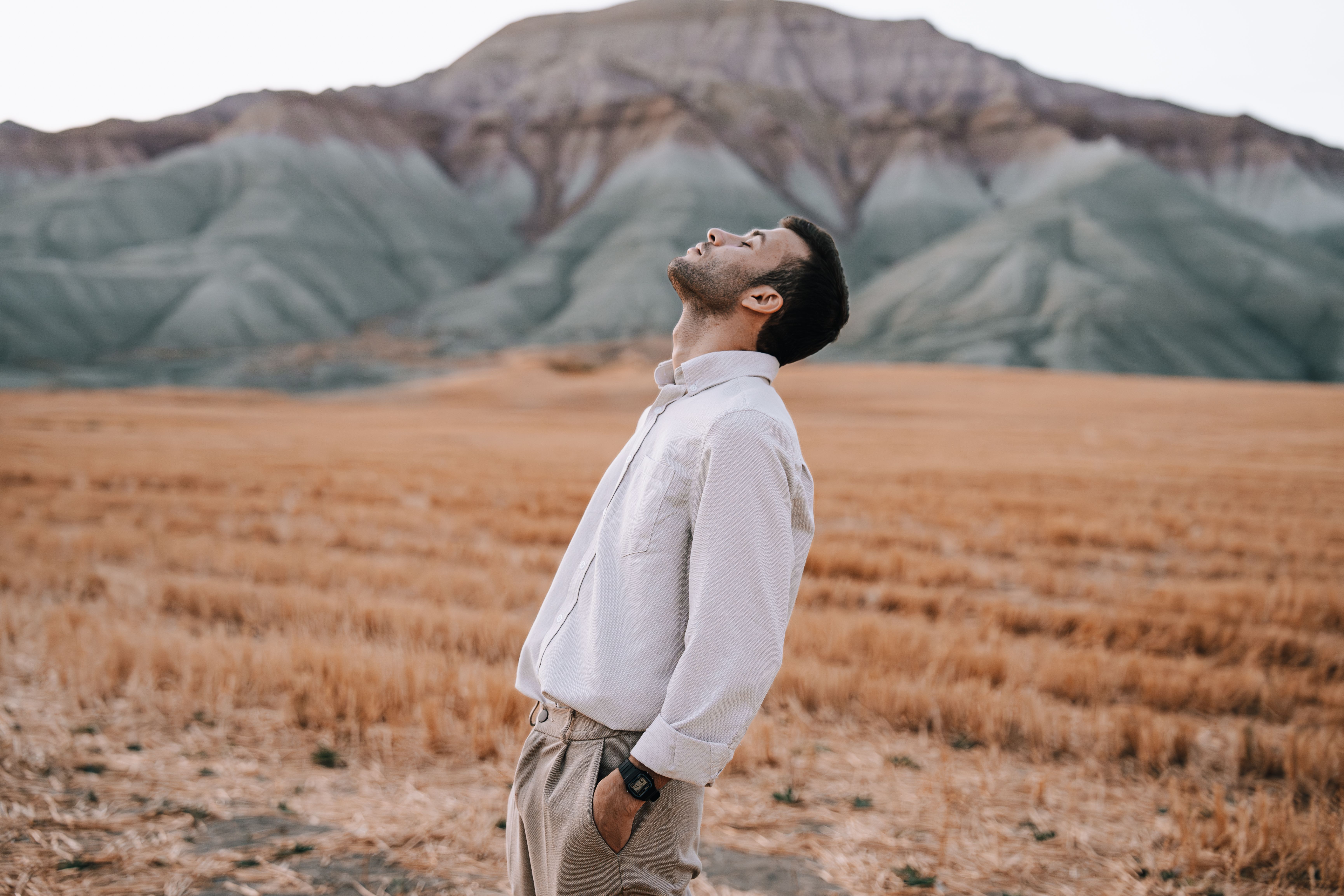 A Man Standing on Green Grass Field · Free Stock Photo