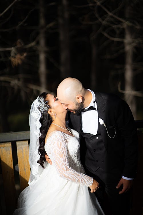 Newlyweds Embracing and Kissing