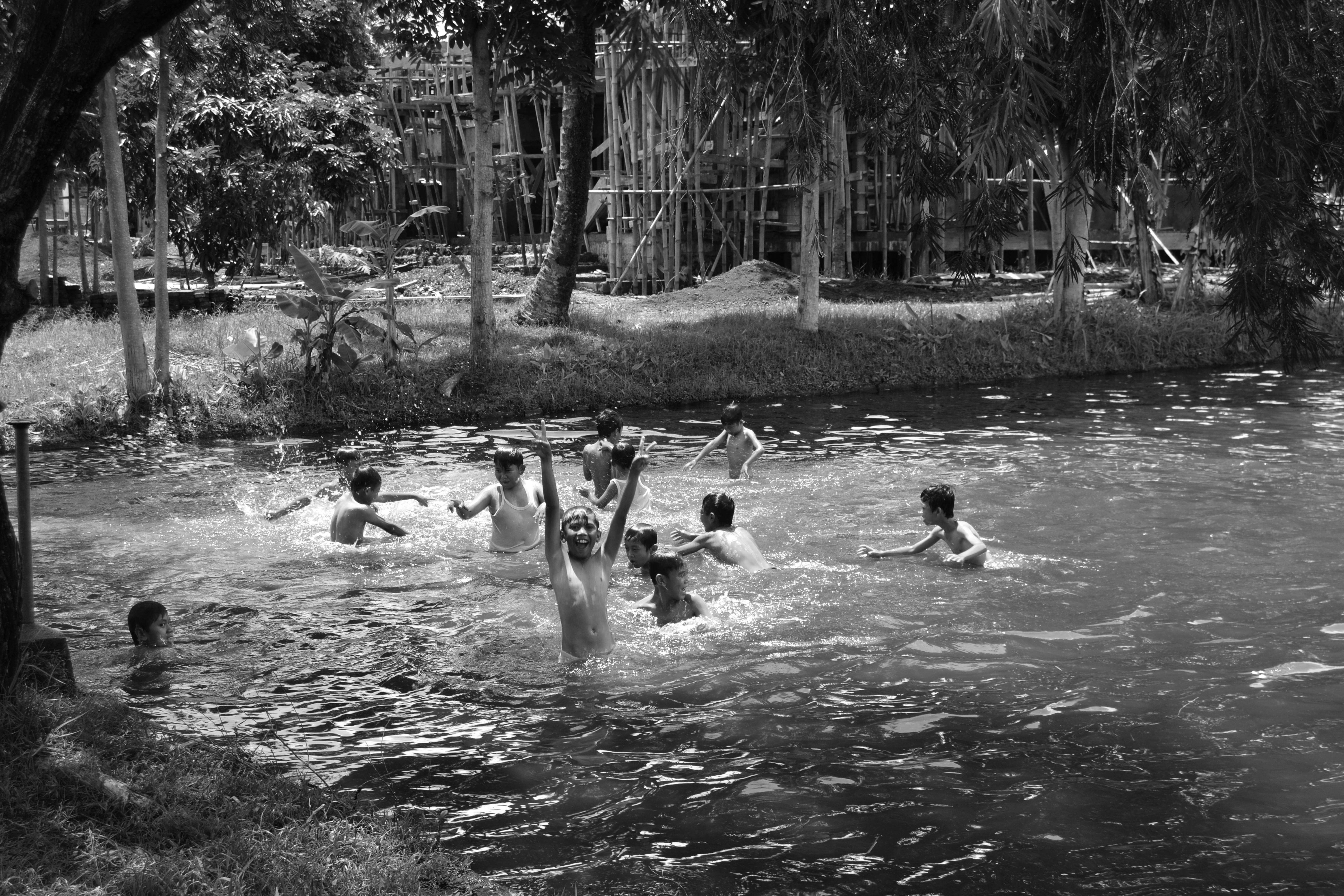 children swimming in the lake