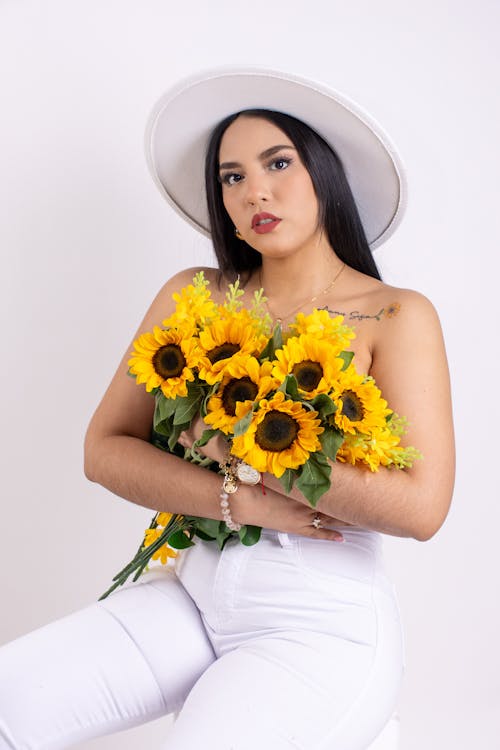 Portrait of Woman Holding Sunflowers 