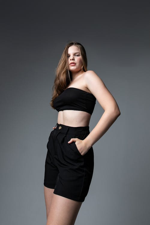 Young Woman Posing in a Black Outfit in Studio 