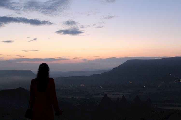 Silhouette Of Woman In A Mountain Valley 