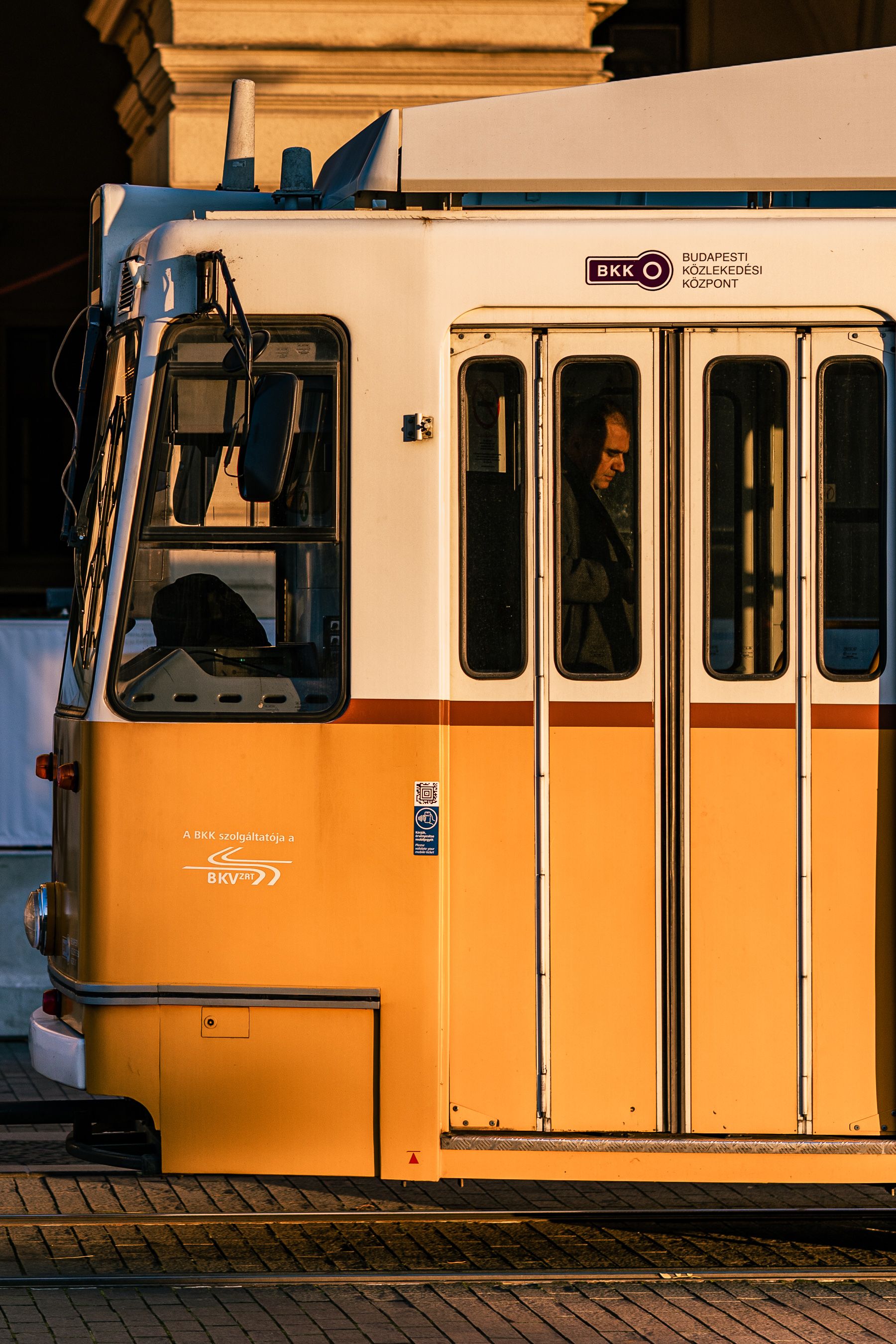 Sun Shining on a Yellow Tram in City · Free Stock Photo