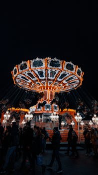 Vibrant night scene with a lit-up carousel at a funfair in Hamburg, Germany, capturing festive vibes.
