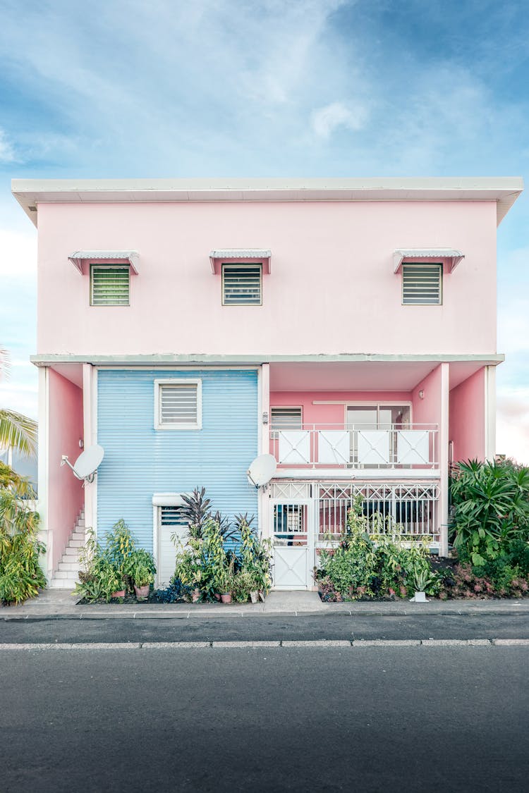 Facade Of A Colorful House Next To The Street 