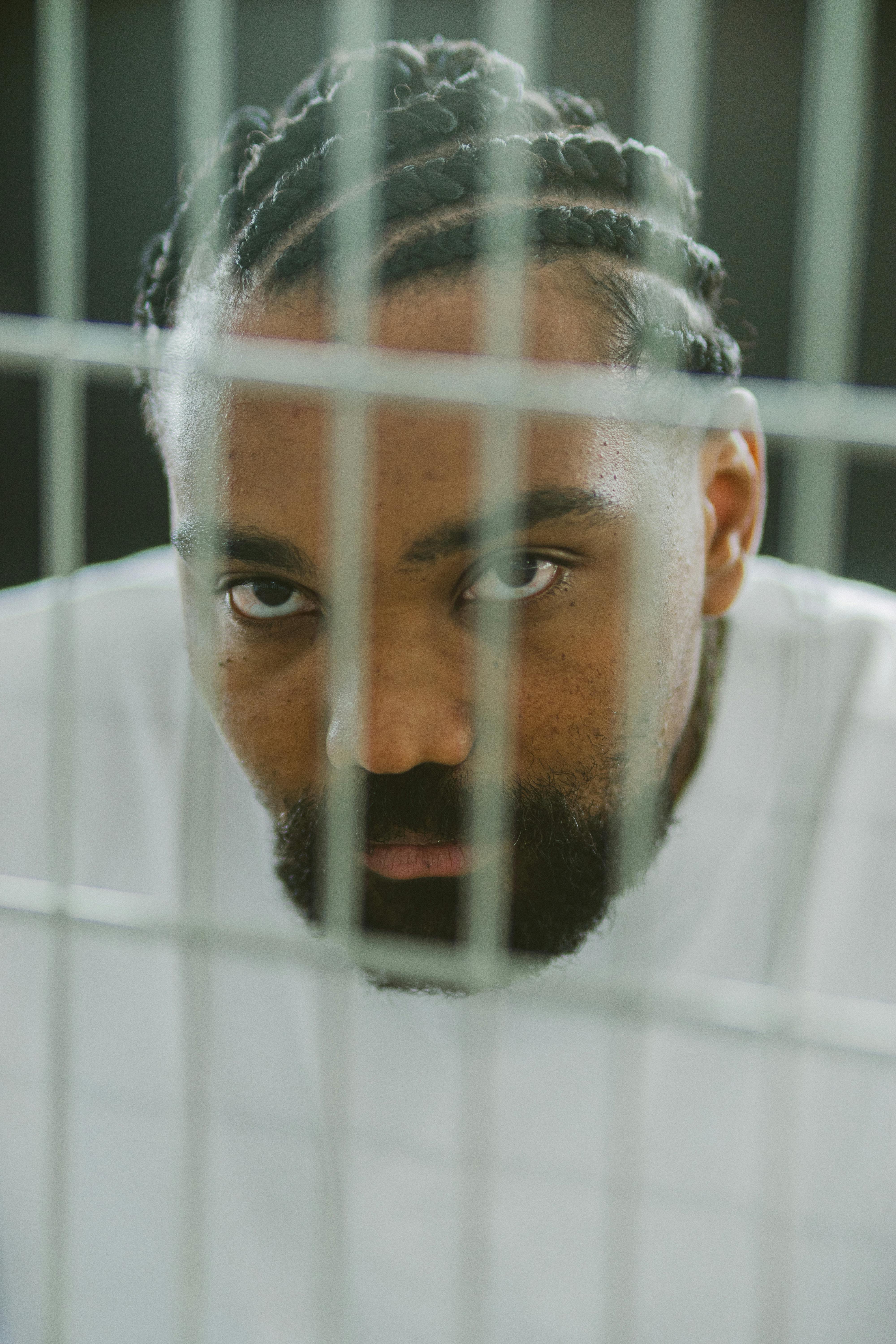 Photo of a Man behind the Bars · Free Stock Photo