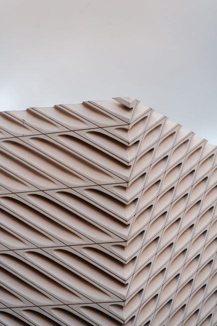 Close-up of a modern, futuristic building facade showcasing a unique geometric pattern.