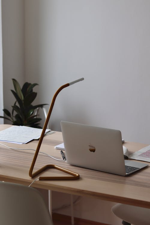 Free Laptop Standing on the Desk in a Modern Interior  Stock Photo