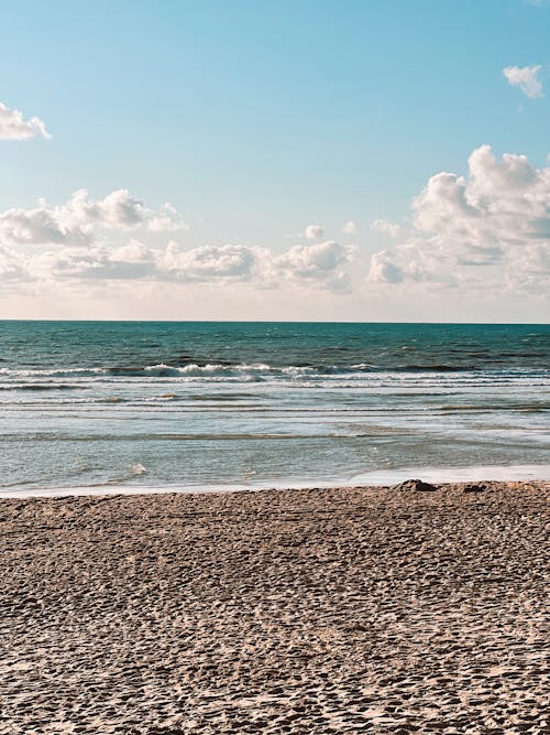 Calm Long Waves Flooding Sandy Beach