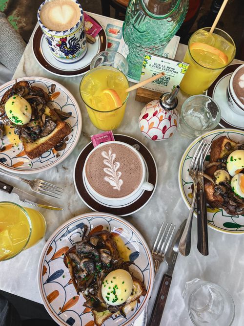 Free A colorful breakfast spread with eggs benedict, orange juice, and coffee. Stock Photo