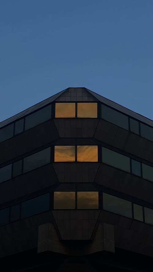 Glowing Windows in a Building at Night 