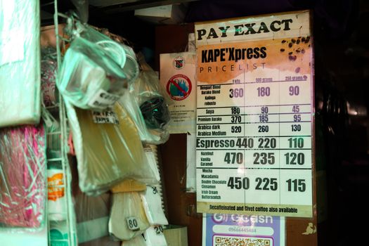A detailed price list showcasing coffee varieties at a small café, featuring espresso and special blends.