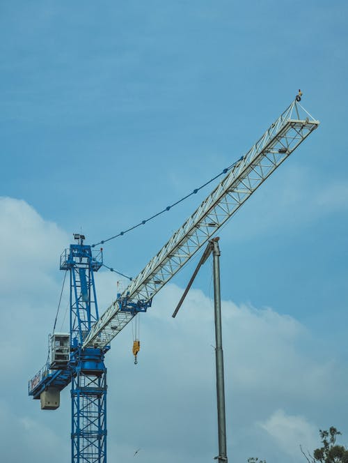 Free Tower Crane Boom Against the Blue Sky Stock Photo