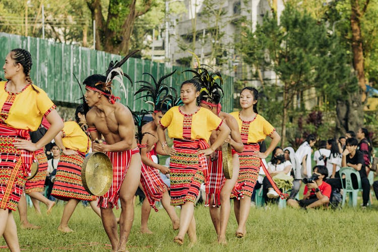 Group Of Performers In Indonesian Folk Costumes Dancing For The Audience At A Festival