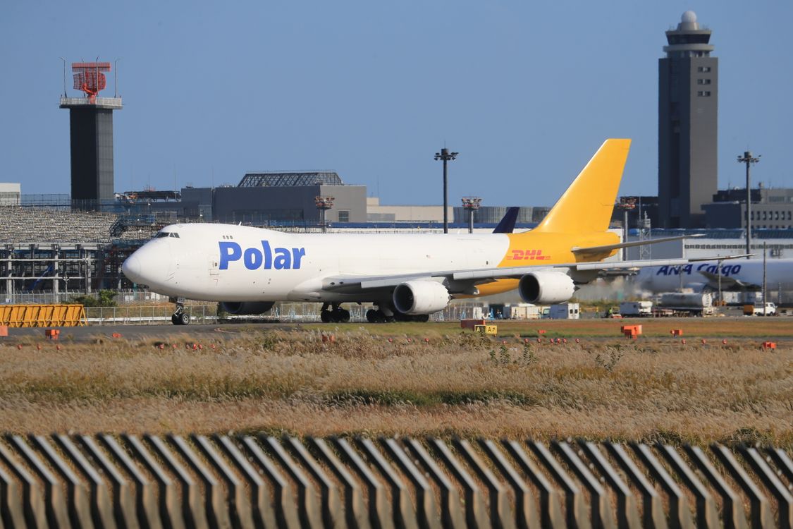 Cargo aircraft at Narita International Airport with the control tower visible